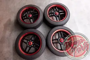Tom's New Action 15x6.5 +32 4x100 with Tires